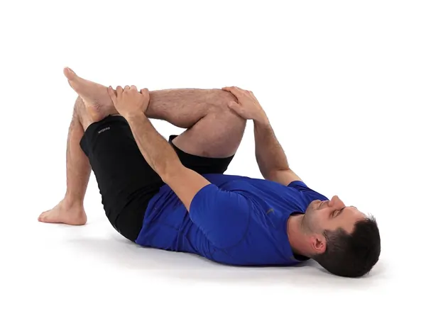 Ankle-over-knee piriformis stretch